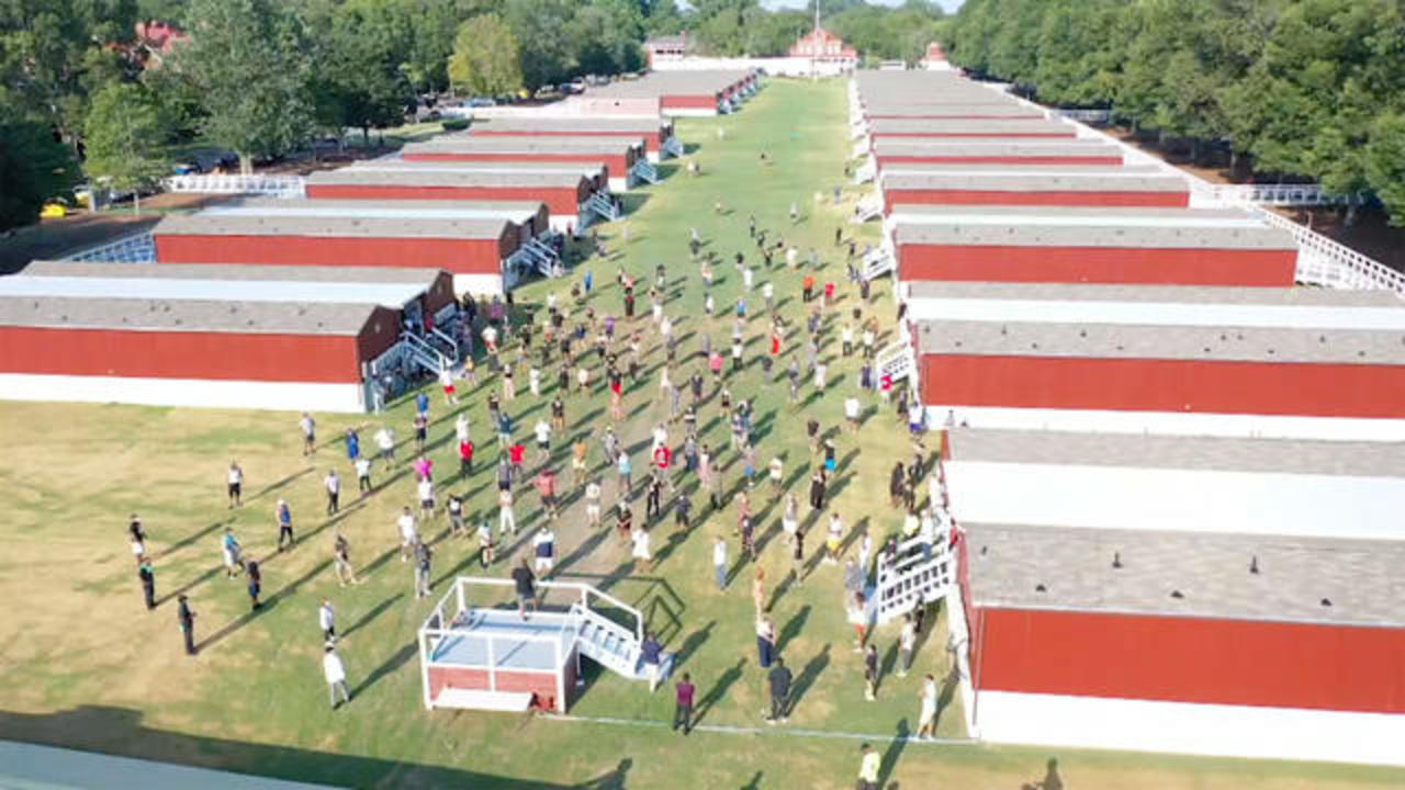 Aerial view of a large-scale man camp facility with hundreds of workers
